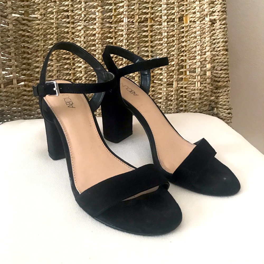 Black suede high heels with ankle strap by Abound